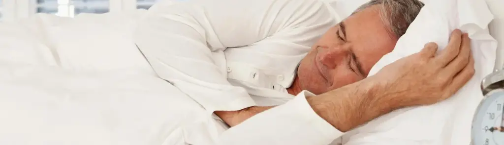 man laying down with sleep apnea