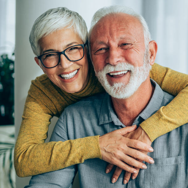 mature man and woman smiling together