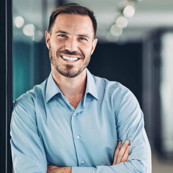 adult man smiling in office