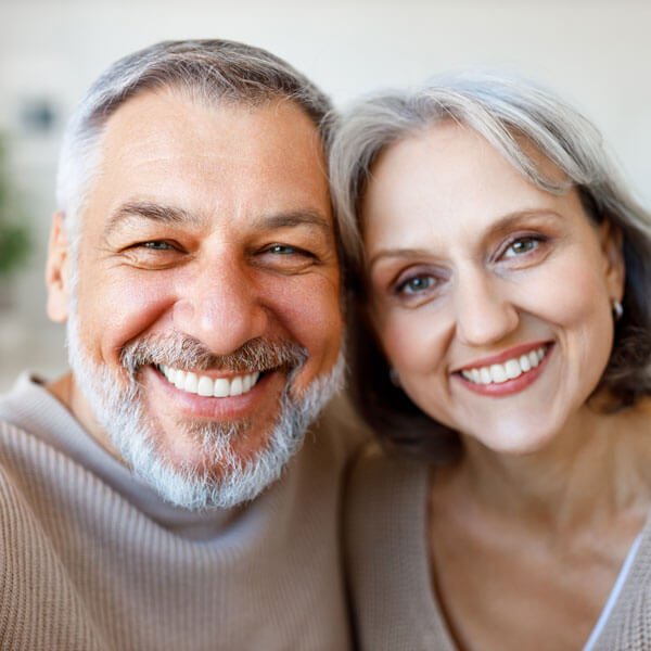 mature man and woman smiling together