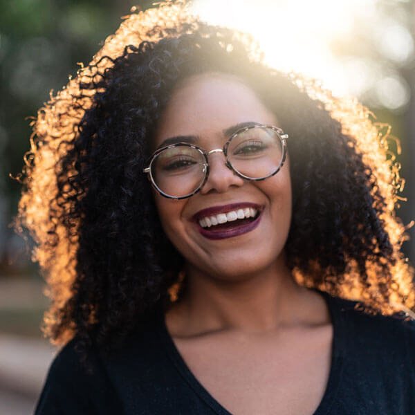 adult woman smiling outdoors